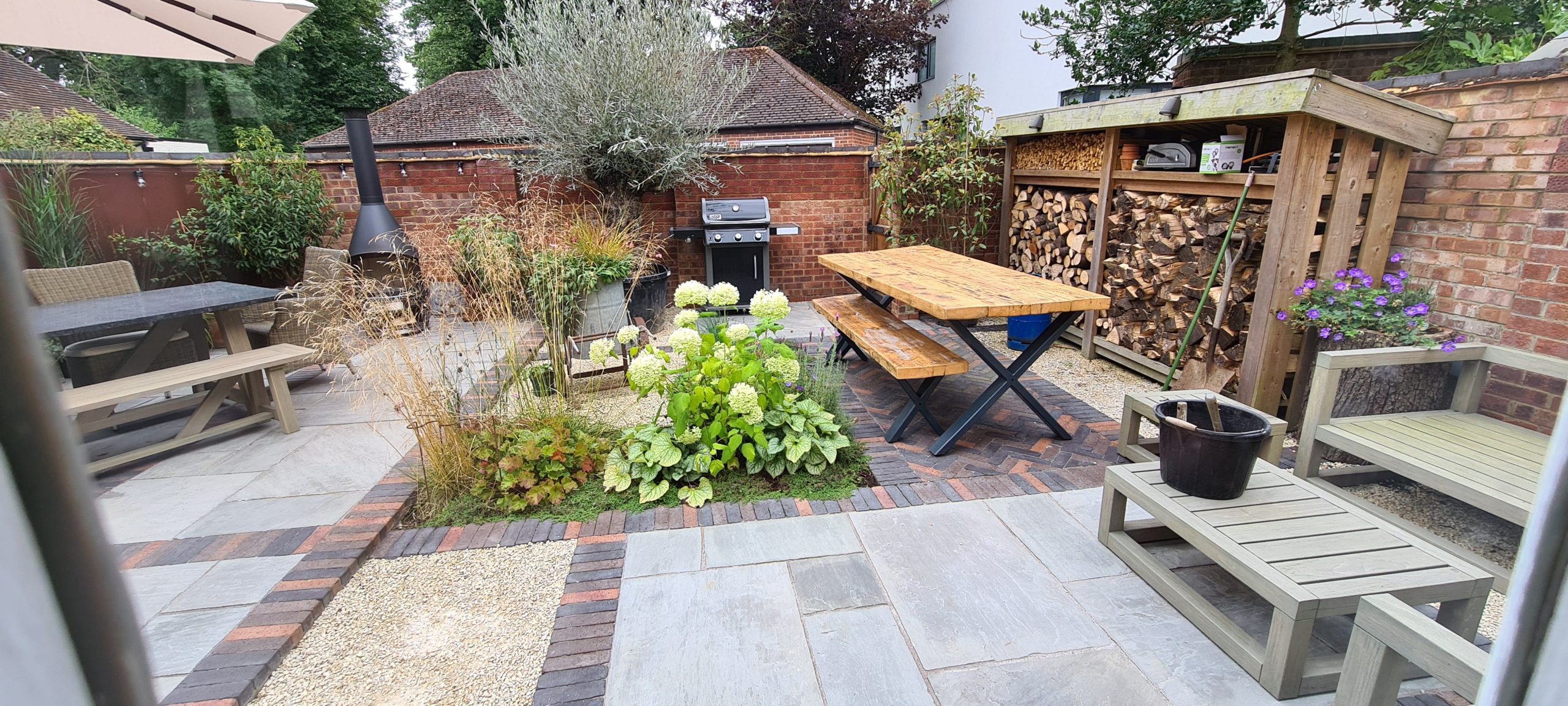 Full landscape garden with patio, stone and herringbone borders